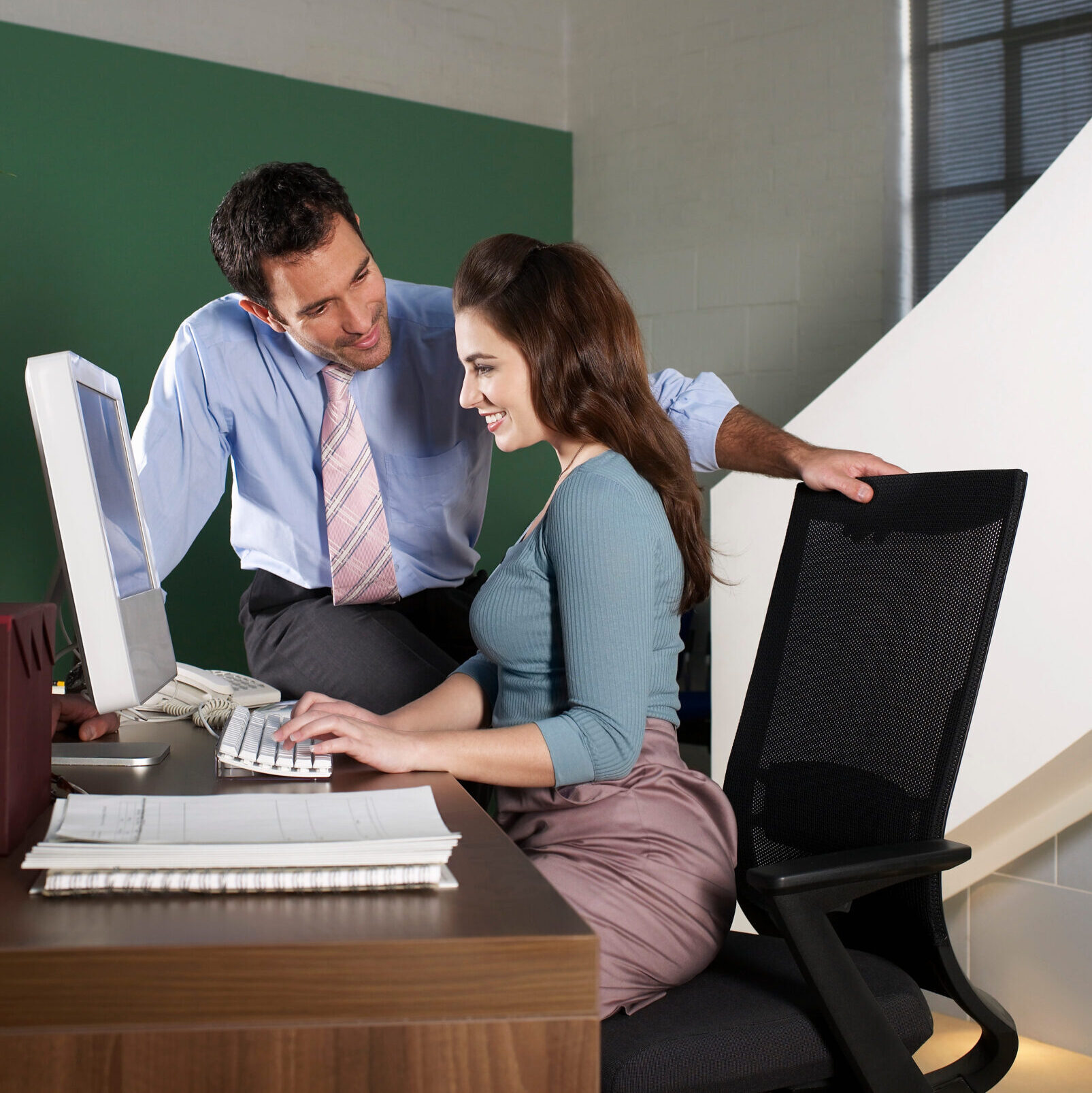 Office receptionist with male worker